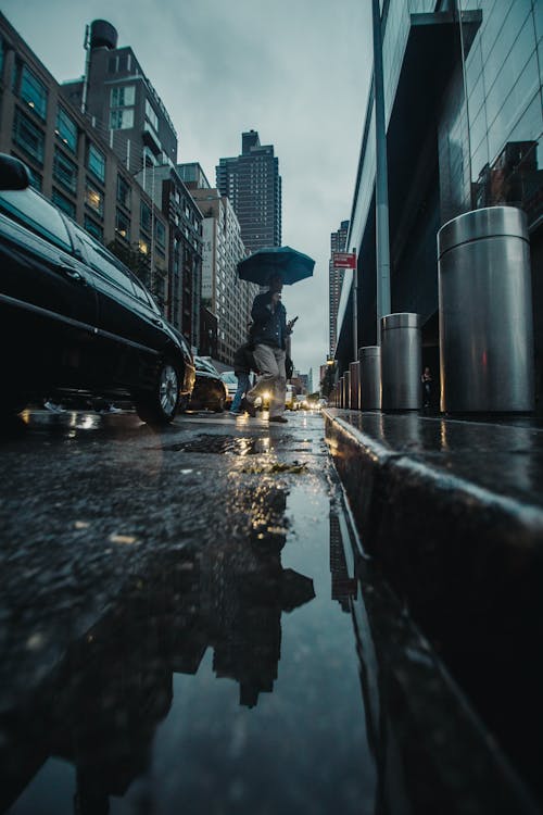 Low Angle Photography of Person Holding Umbrella