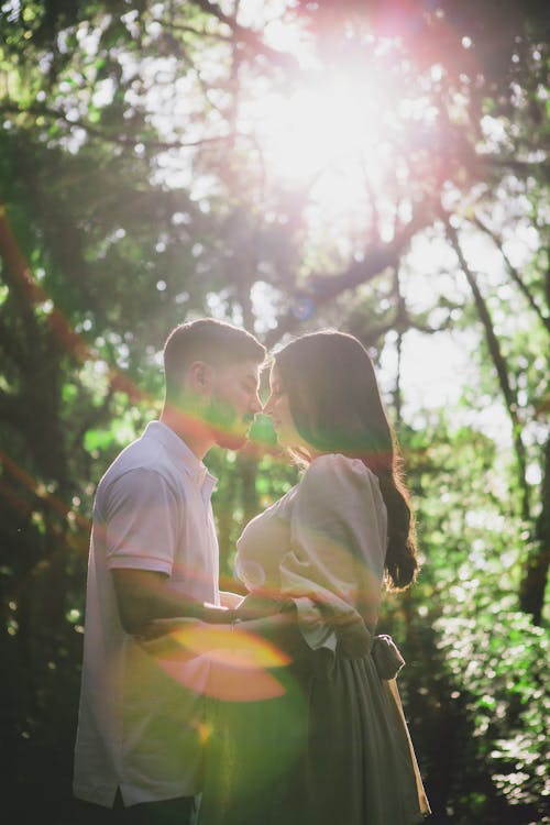 Couple in a Forest in Sunlight
