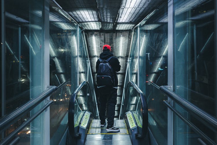 Man Standing On Escalator 