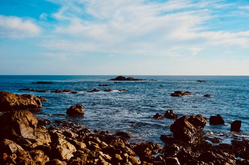 Free Breathtaking view of a rocky shoreline and clear blue sea in Porto, Portugal. Stock Photo