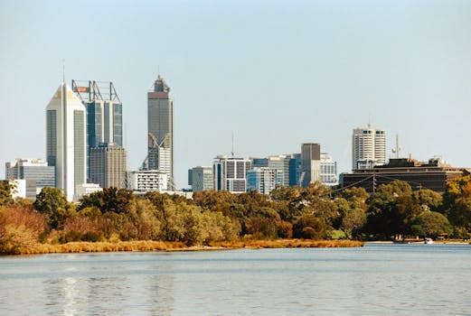 Picturesque view of Perth's skyline with the tranquil Swan River in the foreground.