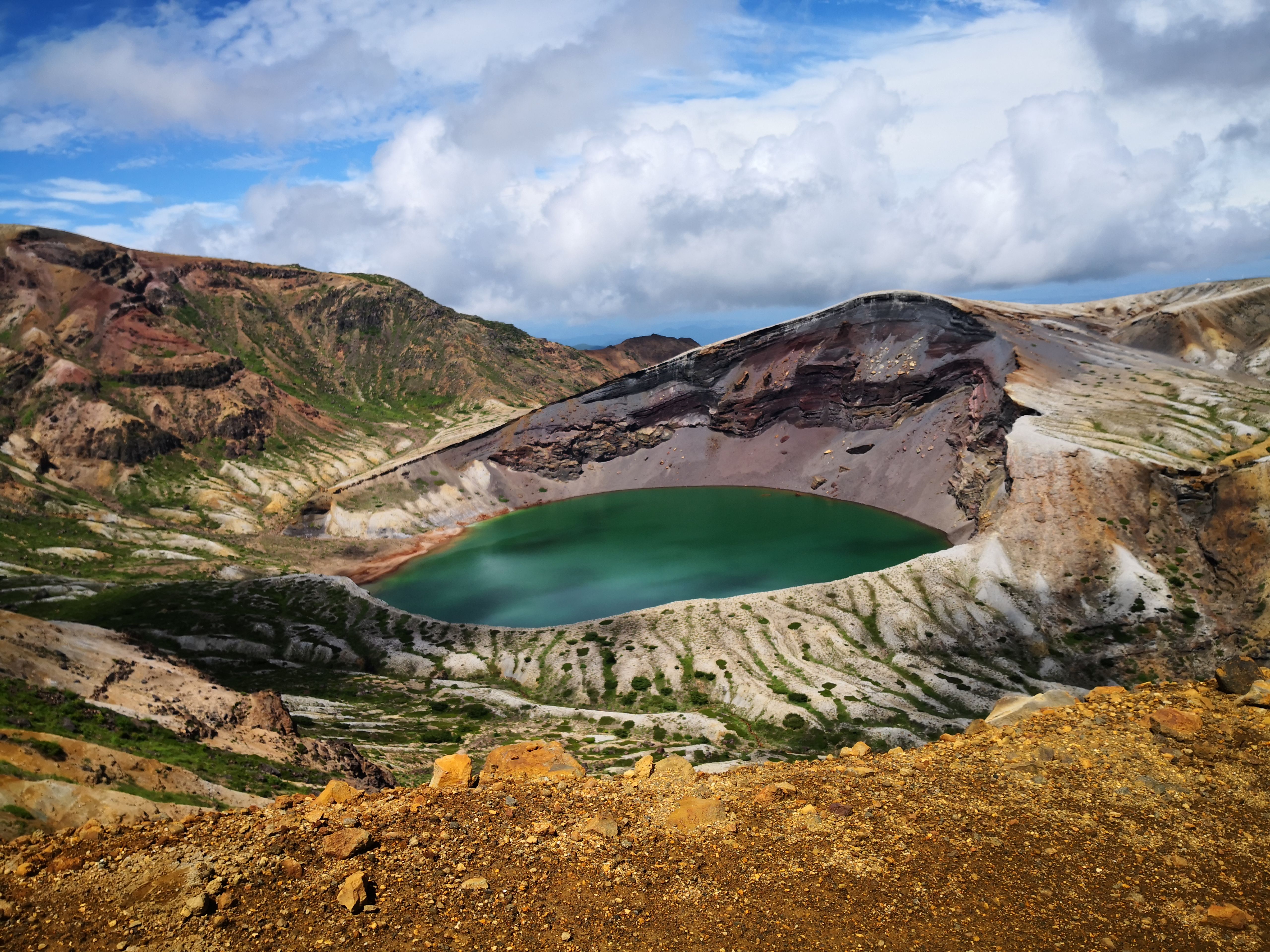 Explore the stunning Okama crater lake in Japan, a unique travel destination with breathtaking volcanic landscapes. - Lonar Crater Lake
