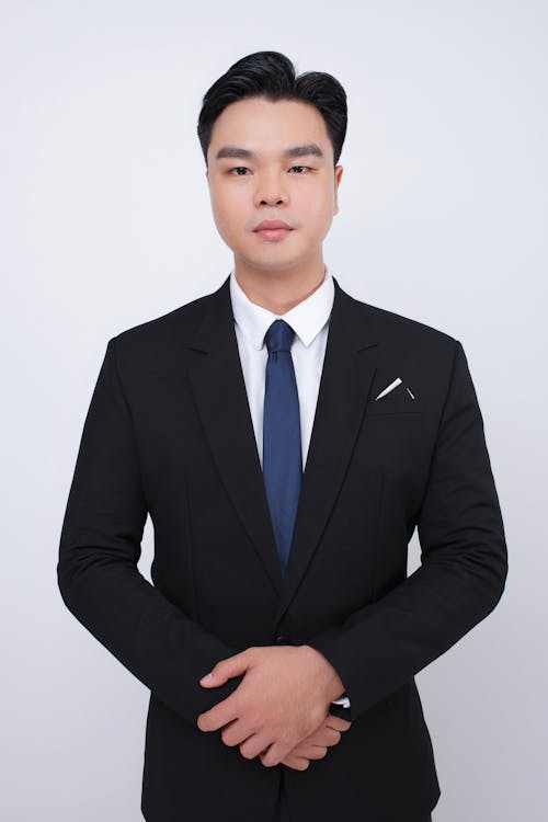 Elegant Man Wearing Necktie to Suit