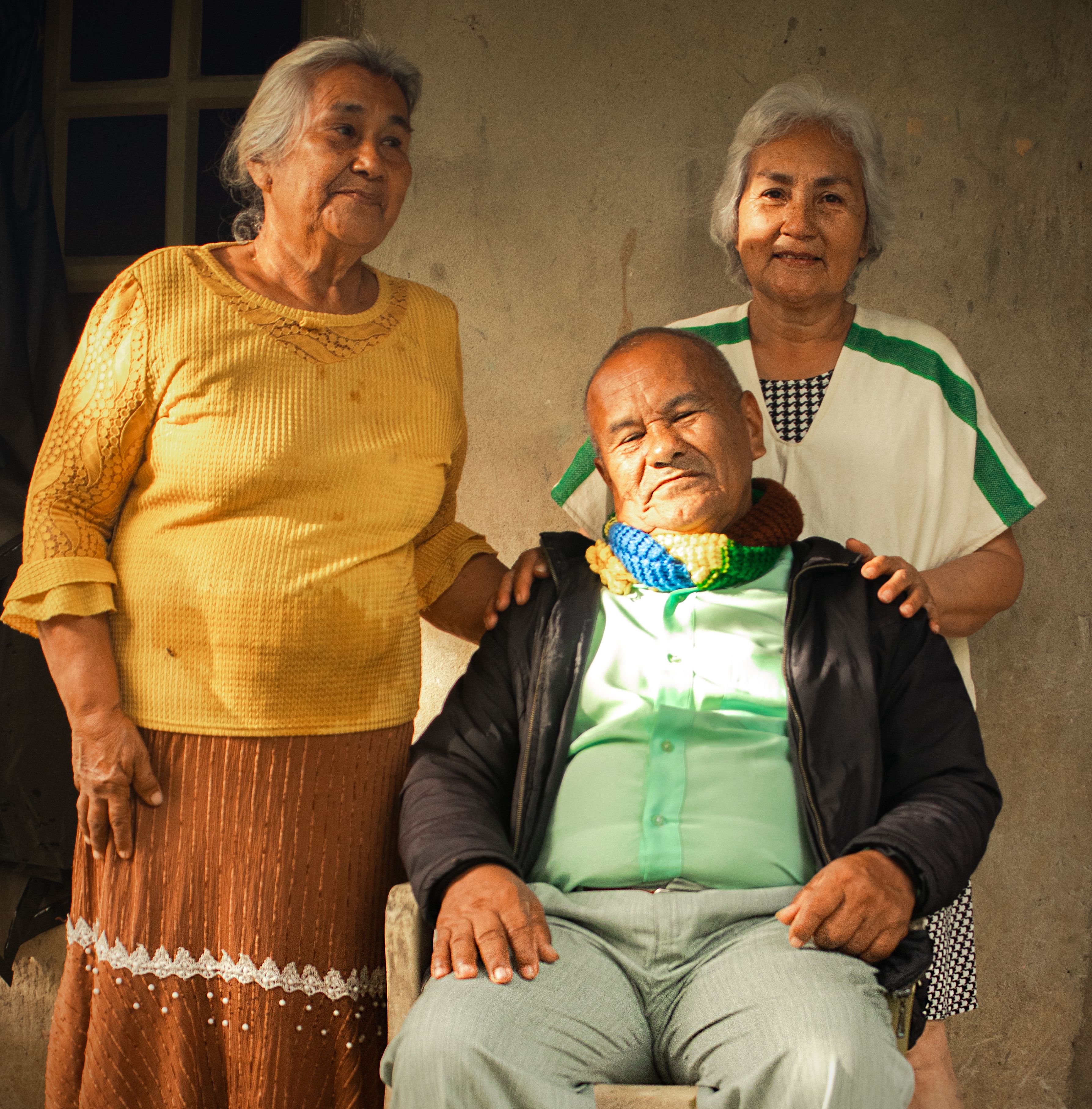 Portrait of a senior Hispanic family smiling together in Florencia, Colombia.