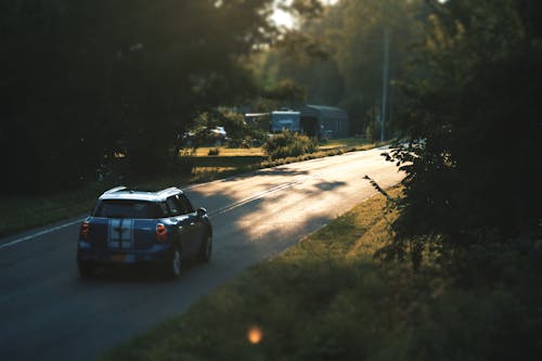 Blue Mini Cooper on Road