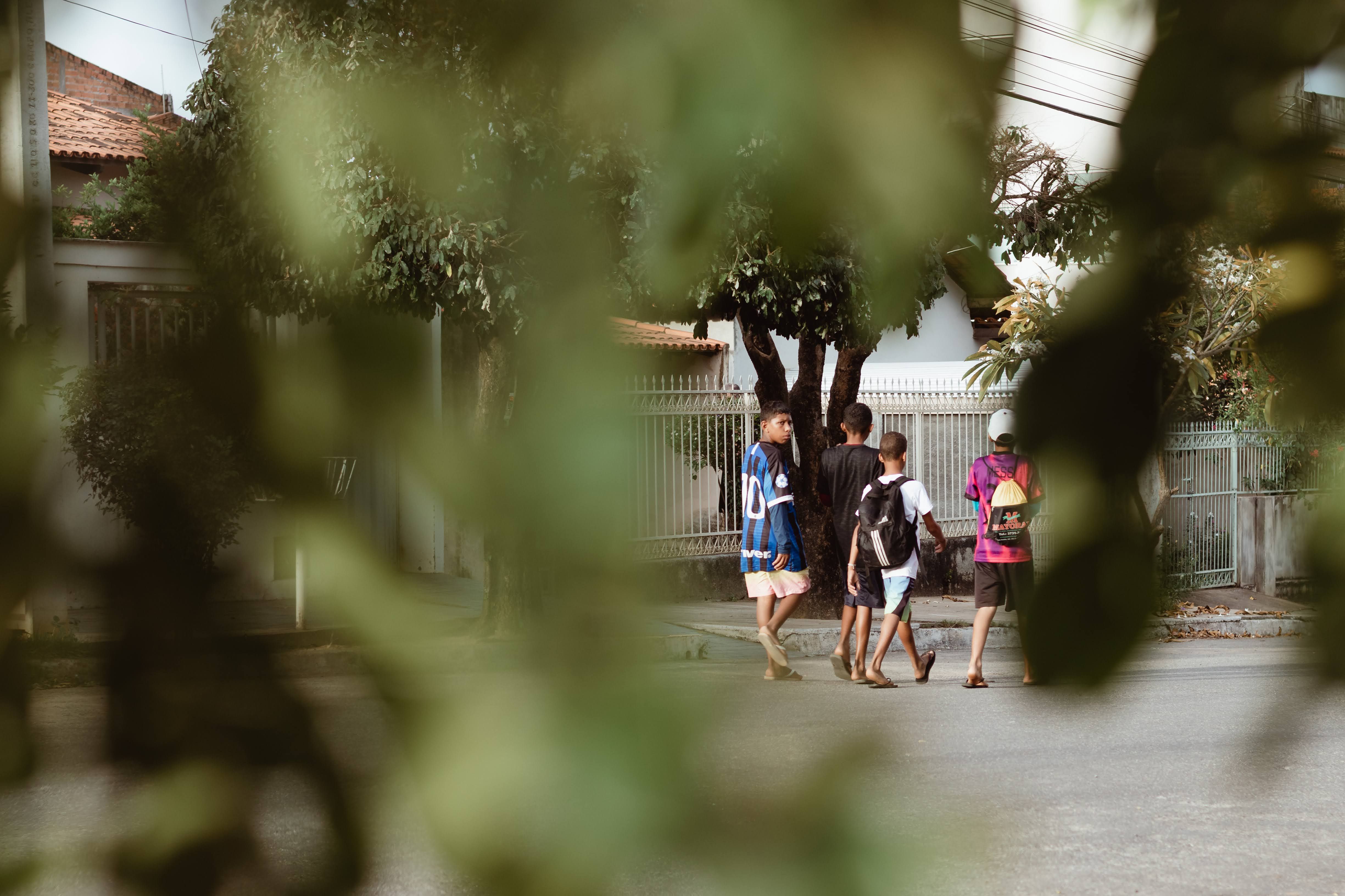 a group of neighbors walking together in a residential area at dusk