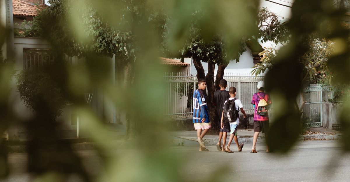 a group of neighbors walking together in a residential area at dusk