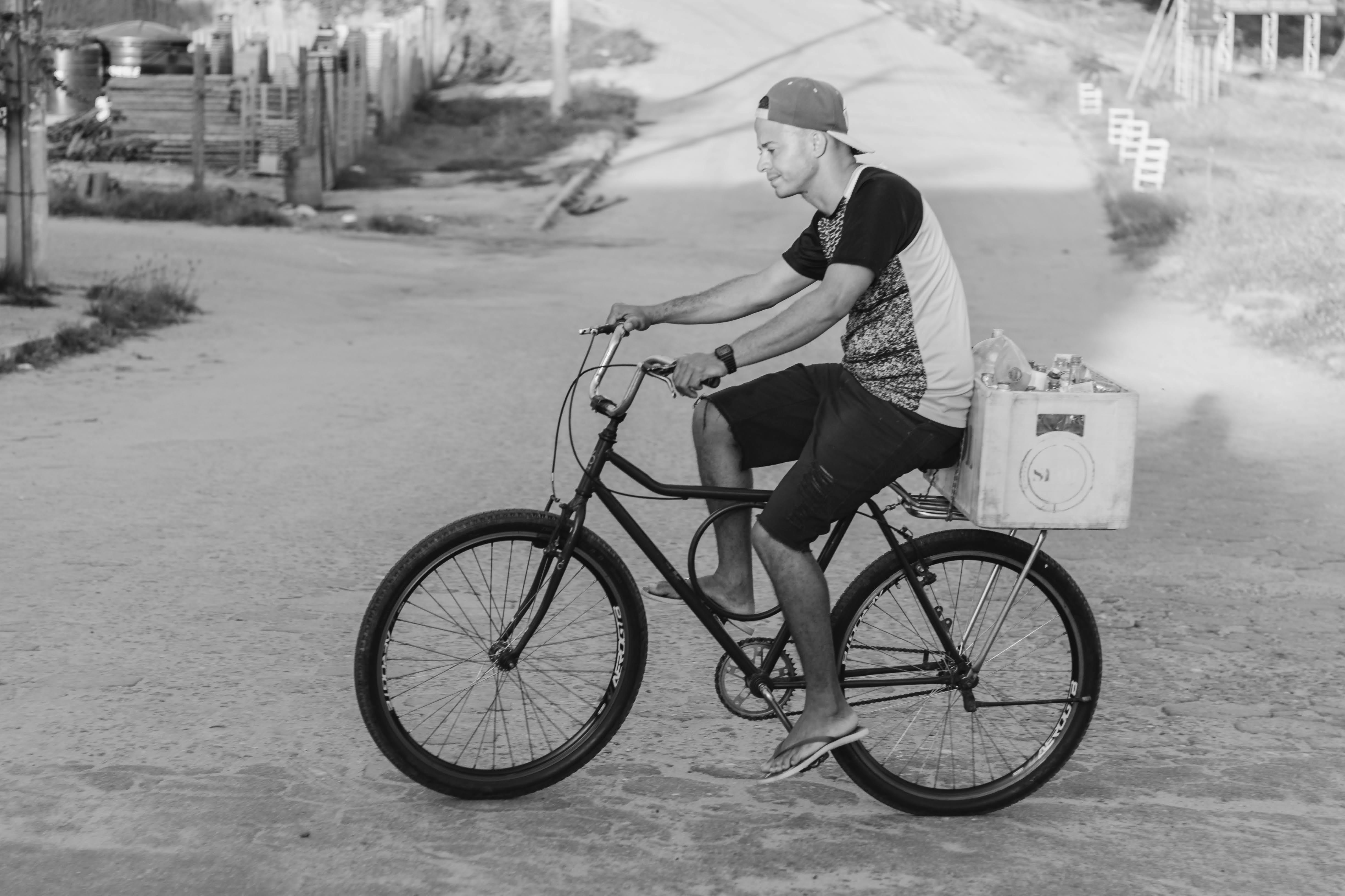 Man on Bicycle in Black and White · Free Stock Photo