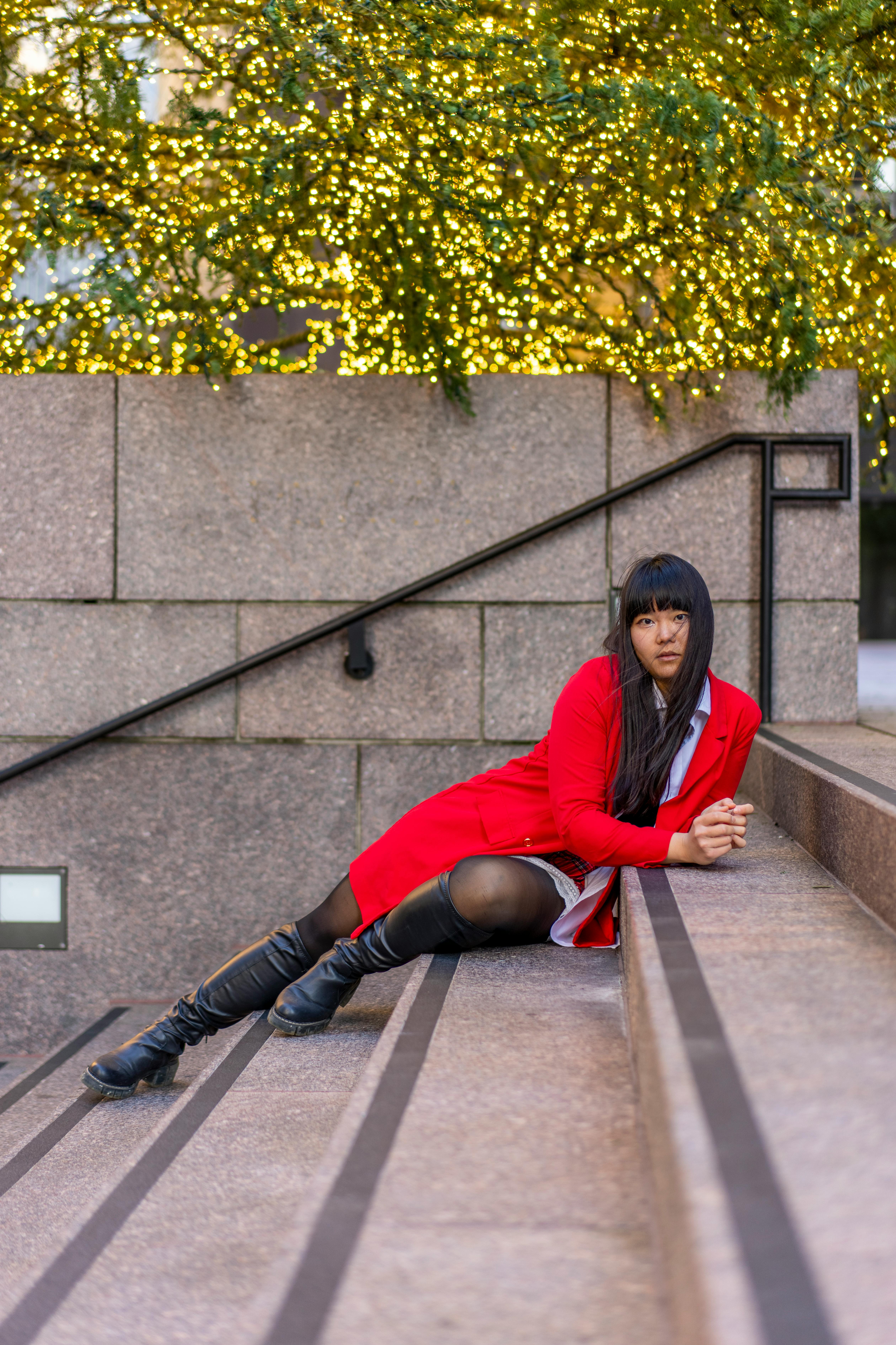 young woman in red jacket at christmas time