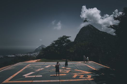 View of Christ the Redeemer from a helipad in Rio de Janeiro, Brazil. Dramatic skyline.