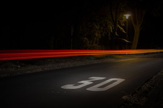 A long exposure night street scene in Mönchengladbach showcasing vibrant car light trails.. pexels, long, exposure