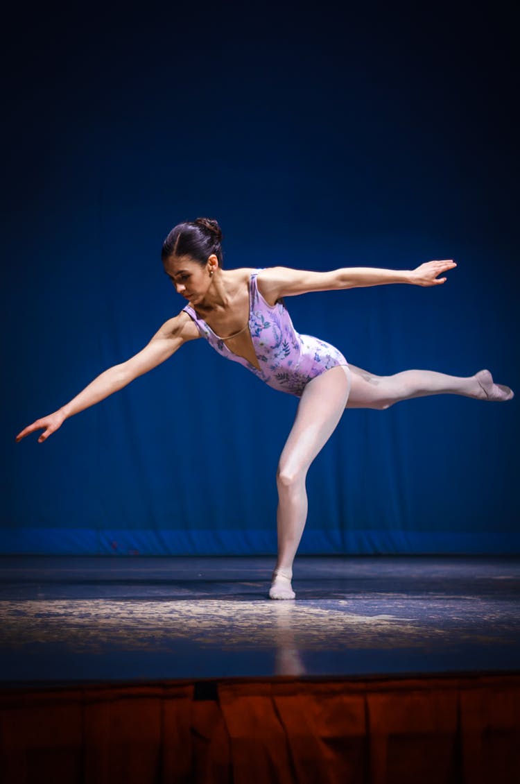 Ballerina Dancing On Stage