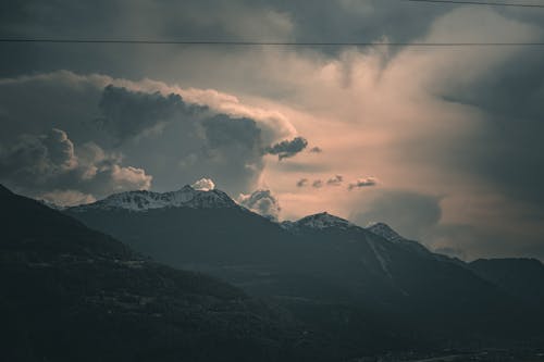 Clouds in Sky in Dark Mountains Landscape