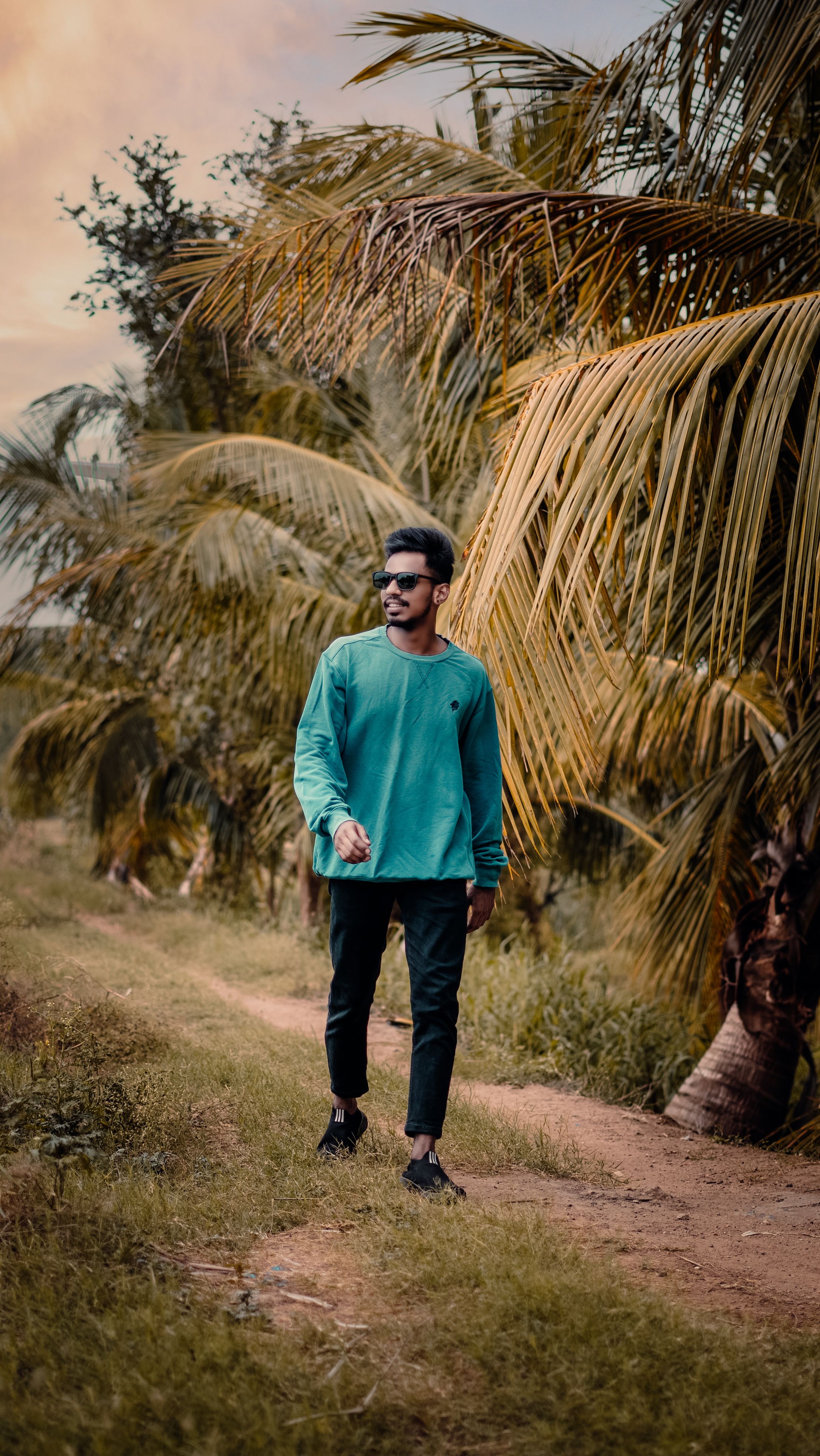 Young Man in Sunglasses Walking on Path in Tropical Forest · Free Stock ...