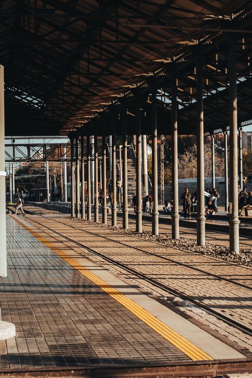 Free Sunlit view of a railway platform in Mendoza, Argentina, showcasing architectural symmetry. Stock Photo