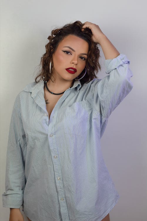 Young Woman Wearing a Blue Shirt and Red Lipstick