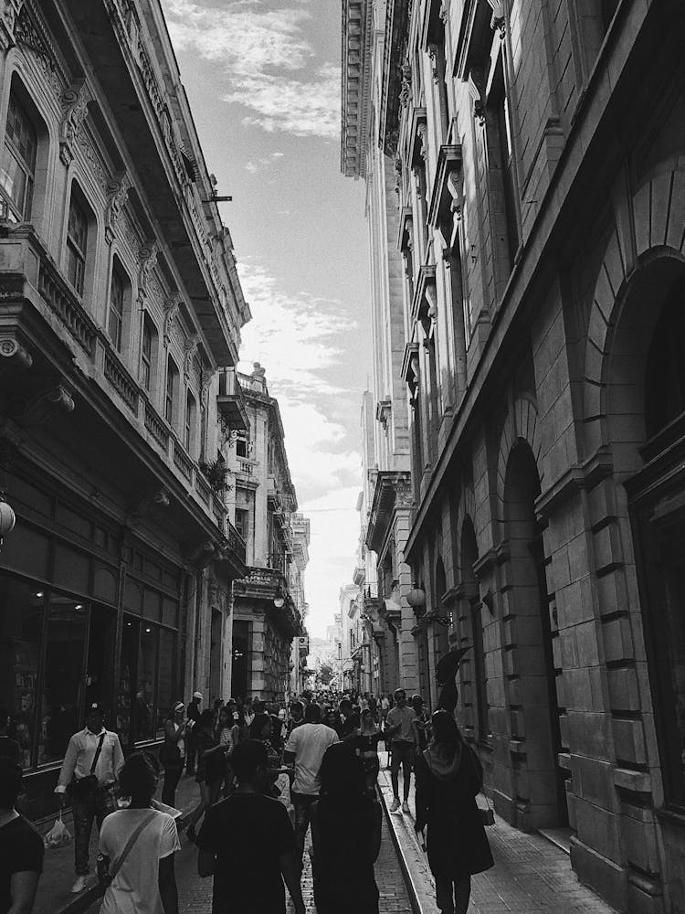 Crowd Of People Walking On Old Town Street