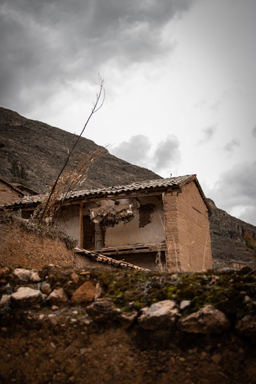 House in the Mountains with a Collapsed Wall