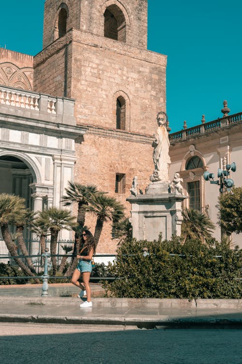 A Statue and Palm Trees in front of the Monreale Cathedral, Monreale, Sicily, Italy 