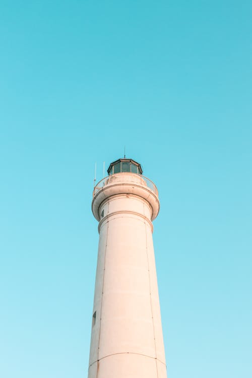 Low Angle Shot of a Lighthouse on the Background of Blue Sky 