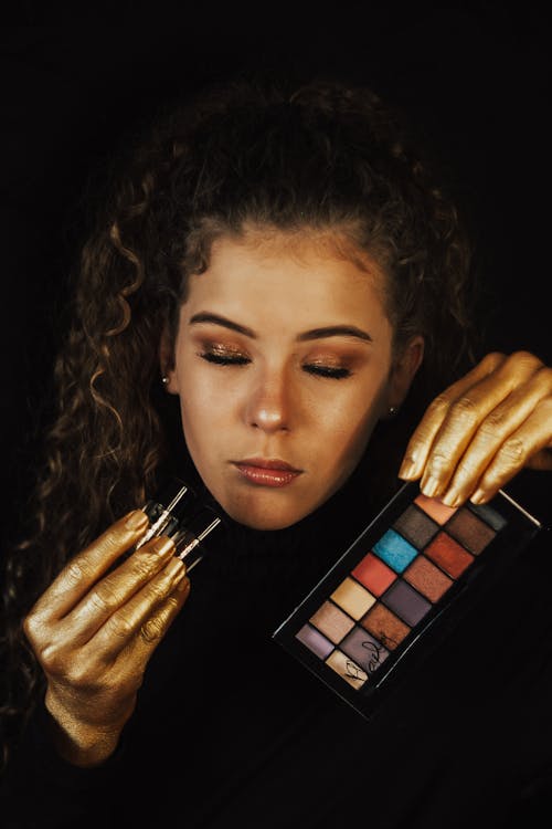 Woman Posing with Colorful Makeup Palette