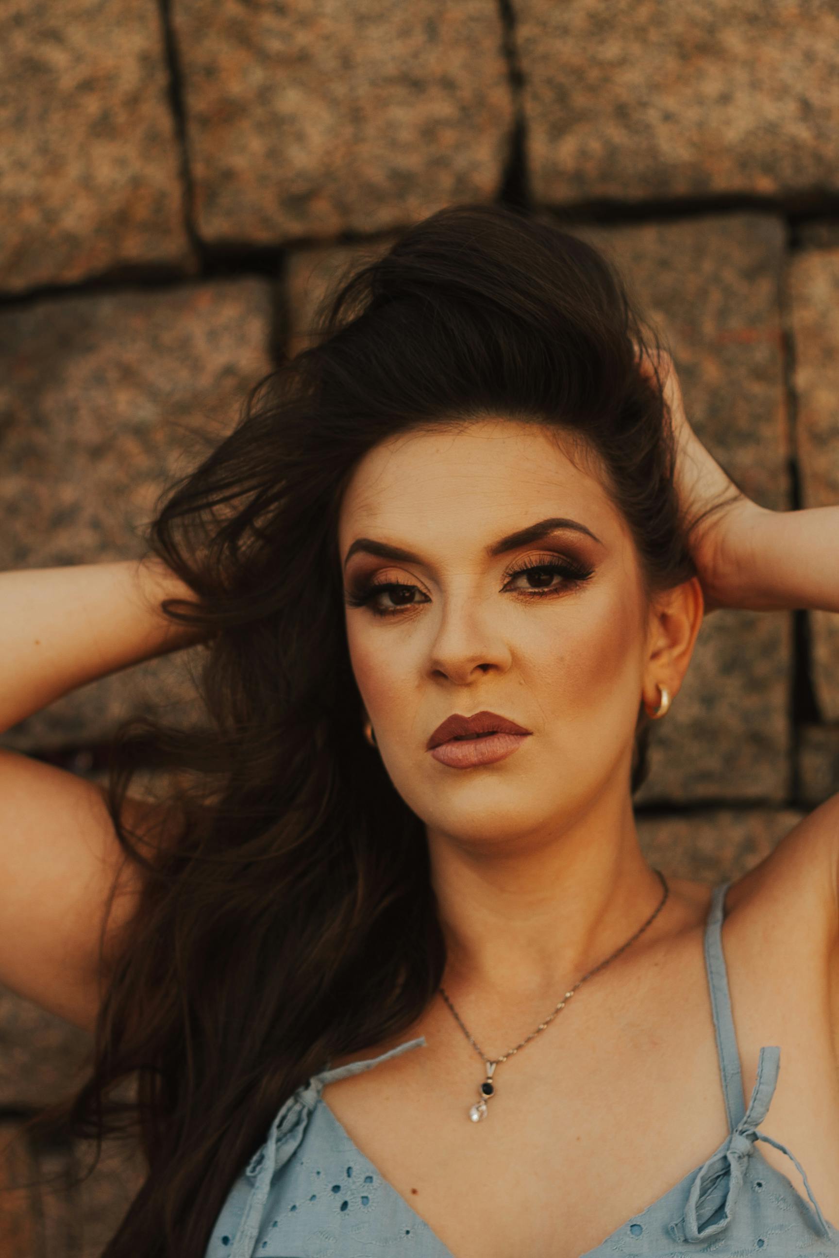 Woman Lifting Her Hair · Free Stock Photo