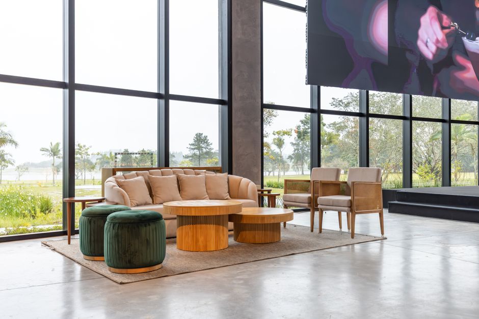 A brightly lit, modern condominium lobby with comfortable seating and a large shared pool area visible through large windows - condominium building insurance A brightly lit, modern condominium lobby with comfortable seating and a large shared pool area visible through large windows - condominium building insurance