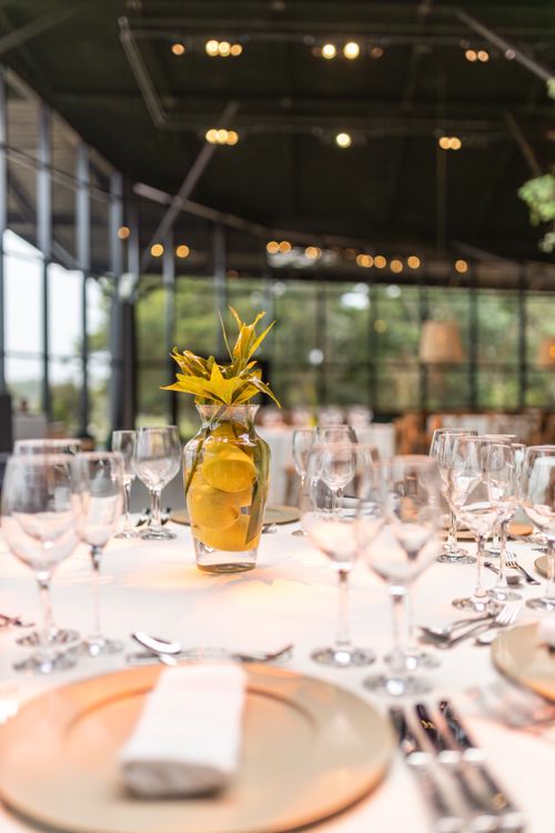 Free Elegant table setup with vase and glassware in a modern restaurant. Stock Photo