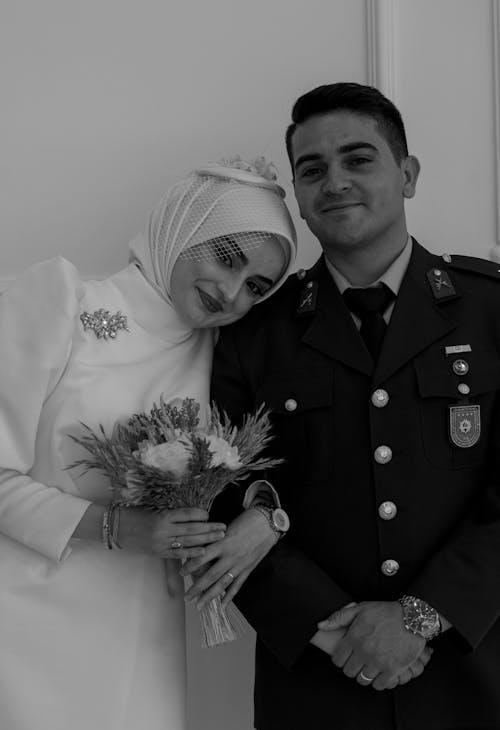 Free Portrait of Newlyweds in Uniform and Hijab Stock Photo