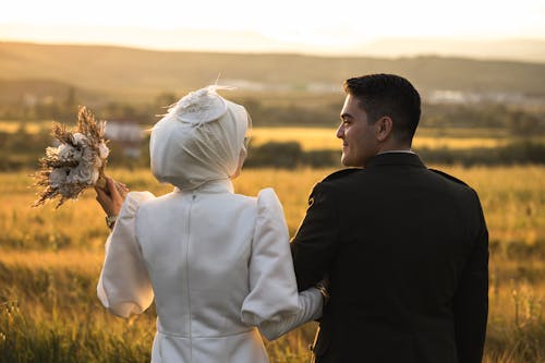 Couple Standing Together with Flowers