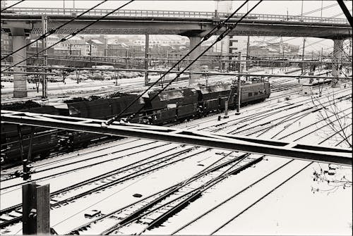 Railway Tracks Covered with Snow in Black and White 