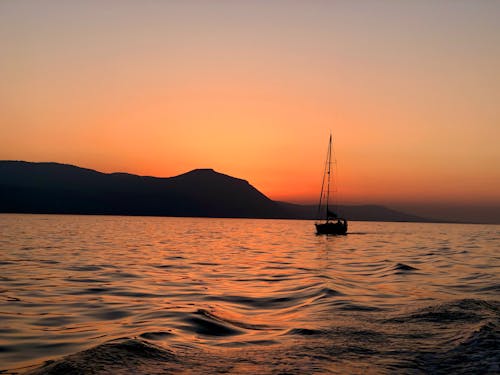 Sailboat on Coast at sunset