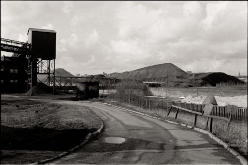 Road in Front of a Factory in a Valley in Black and White 