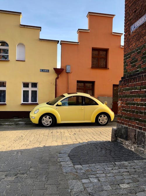 Gratis stockfoto met auto, gebouwen, geel