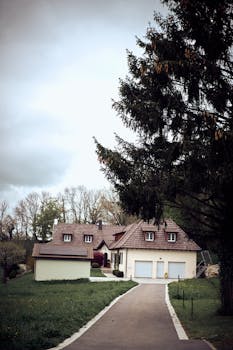 A picturesque rural bungalow surrounded by greenery, featuring a cozy architecture and peaceful setting.