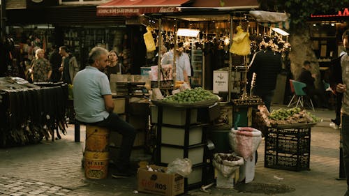 Man Selling Green Apples on Market