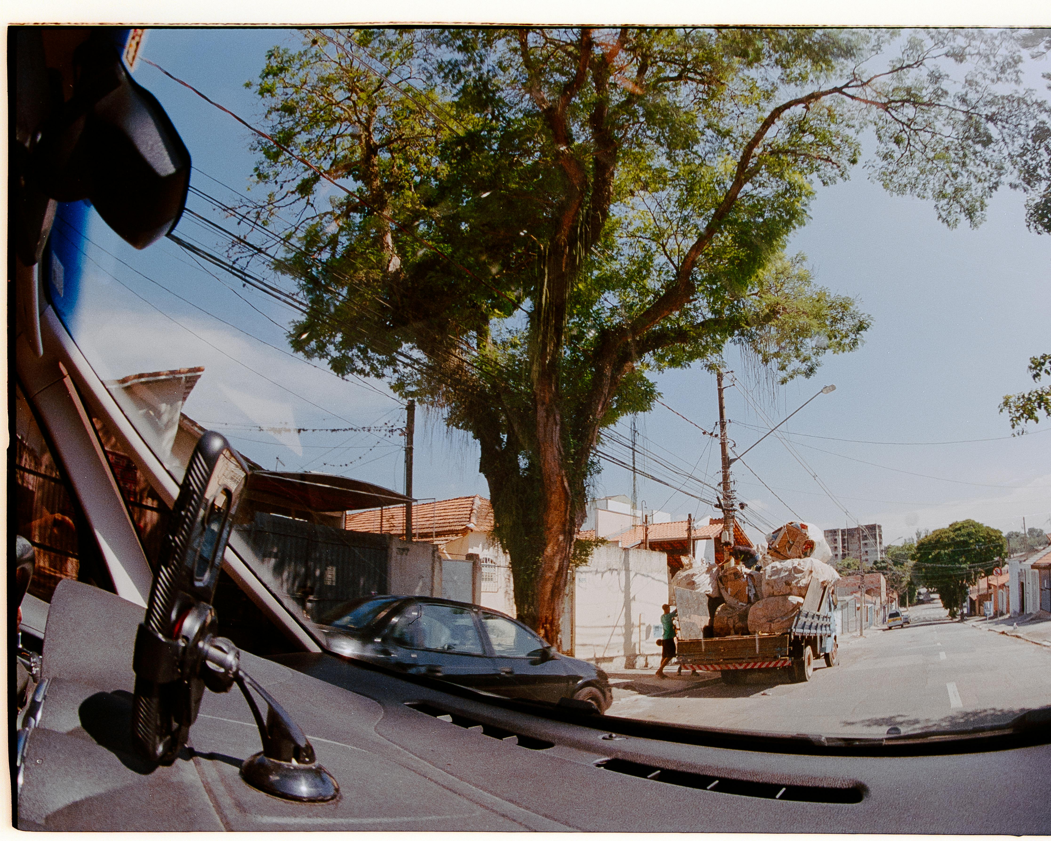 Free View of a city street from inside a car, showcasing urban life and transport. Stock Photo