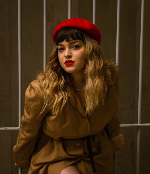 Woman in a Trench Coat and Red Beret 