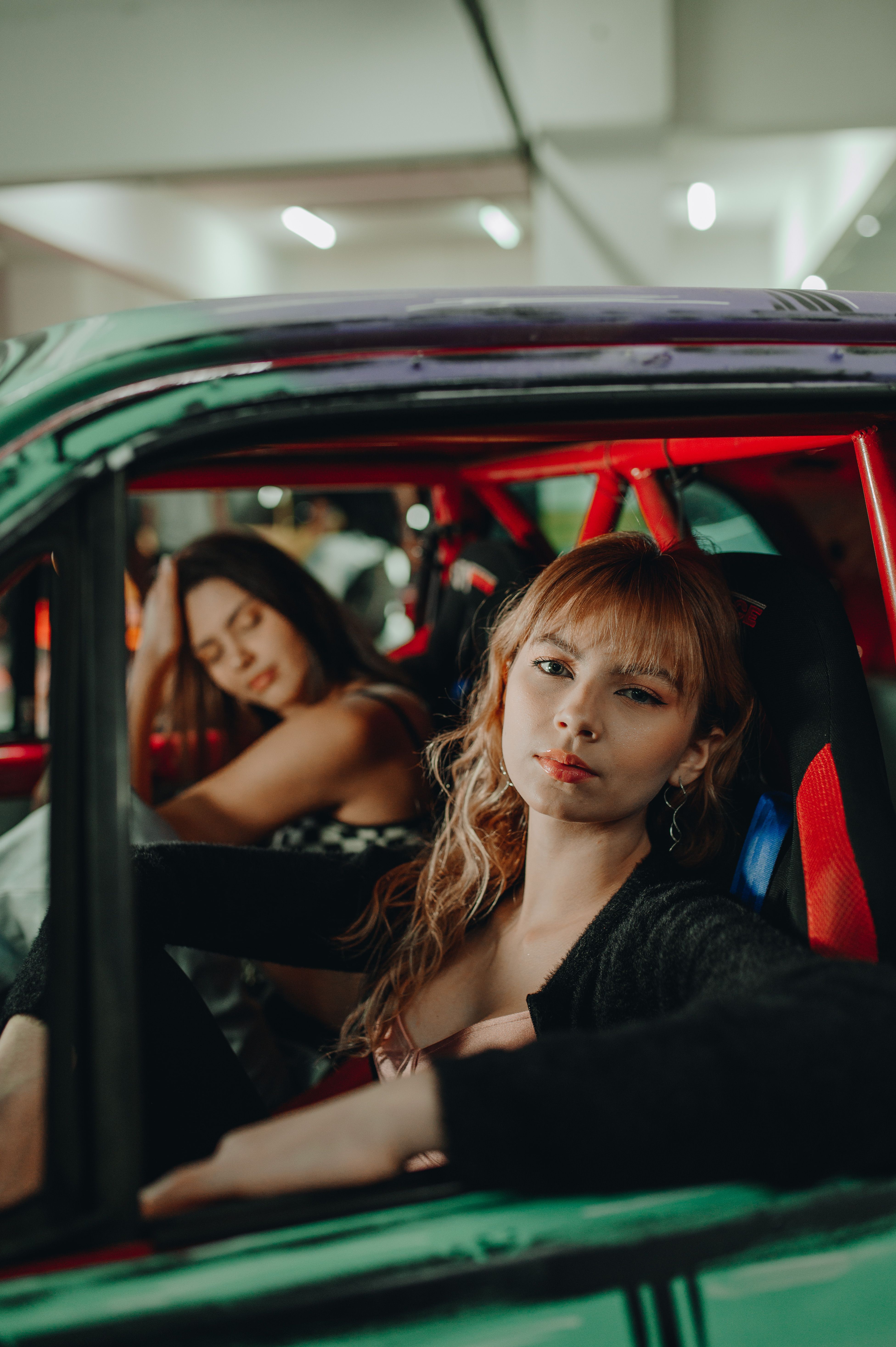 Beautiful Women Sitting in a Car · Free Stock Photo