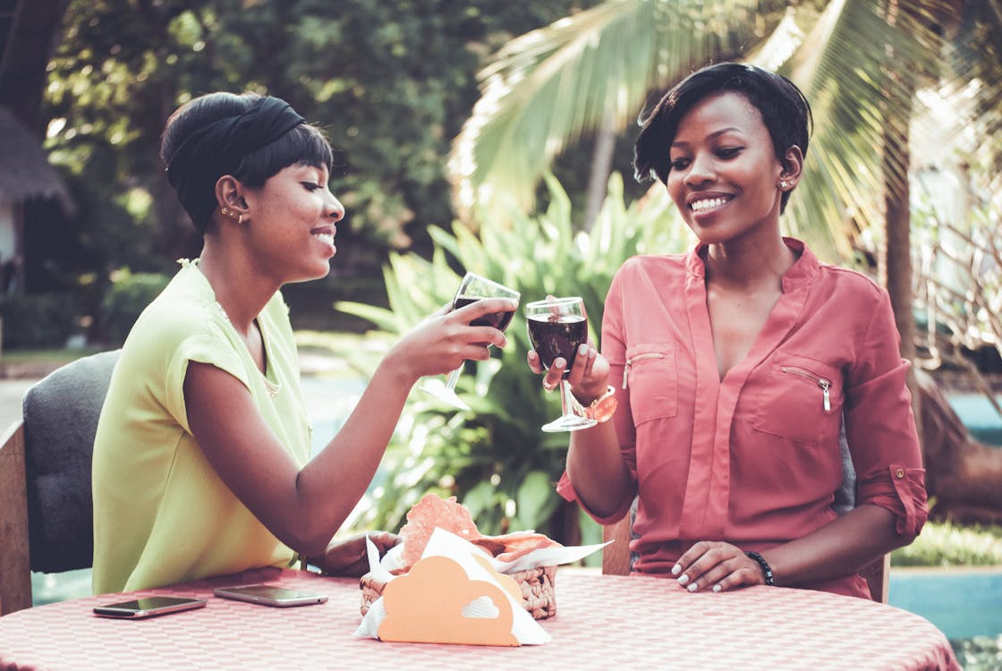 Women Holding Goblets