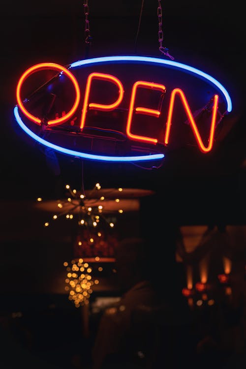 Free Oval Blue and Orange Open Neon Signage Turned-on Stock Photo