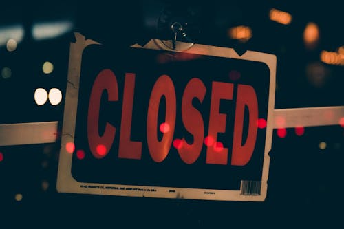 Close-Up Photo of Closed Signboard