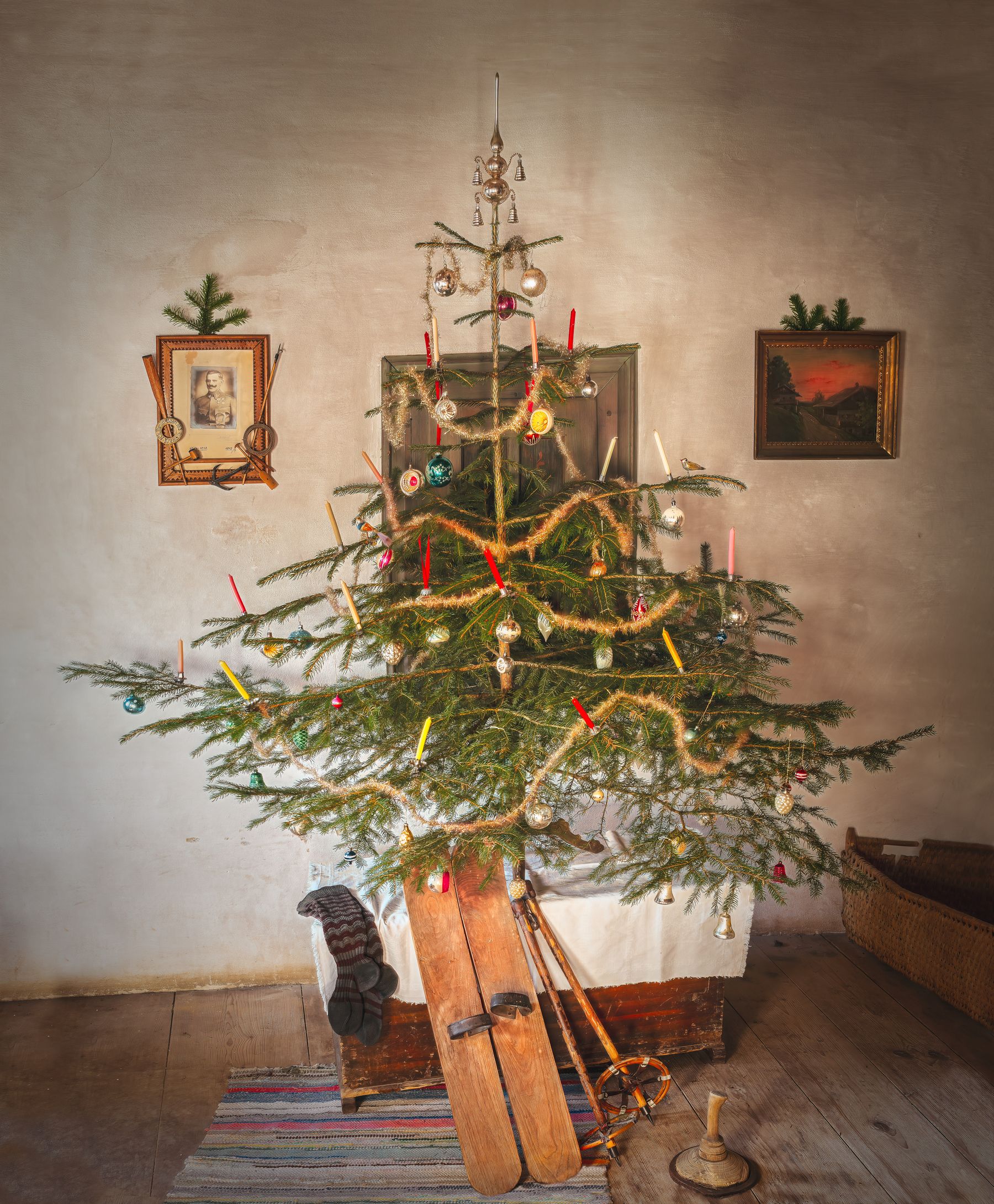 Warm living room with a traditional Christmas tree, collected furnishings and nostalgic seasonal atmosphere