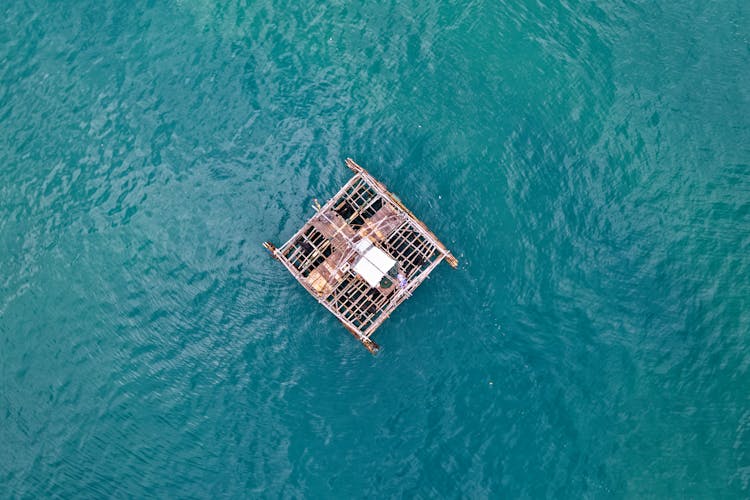 Brown Wooden Raft On Body Of Water