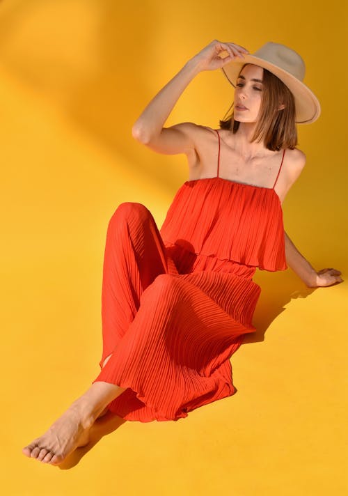 Woman Posing in an Orange Dress