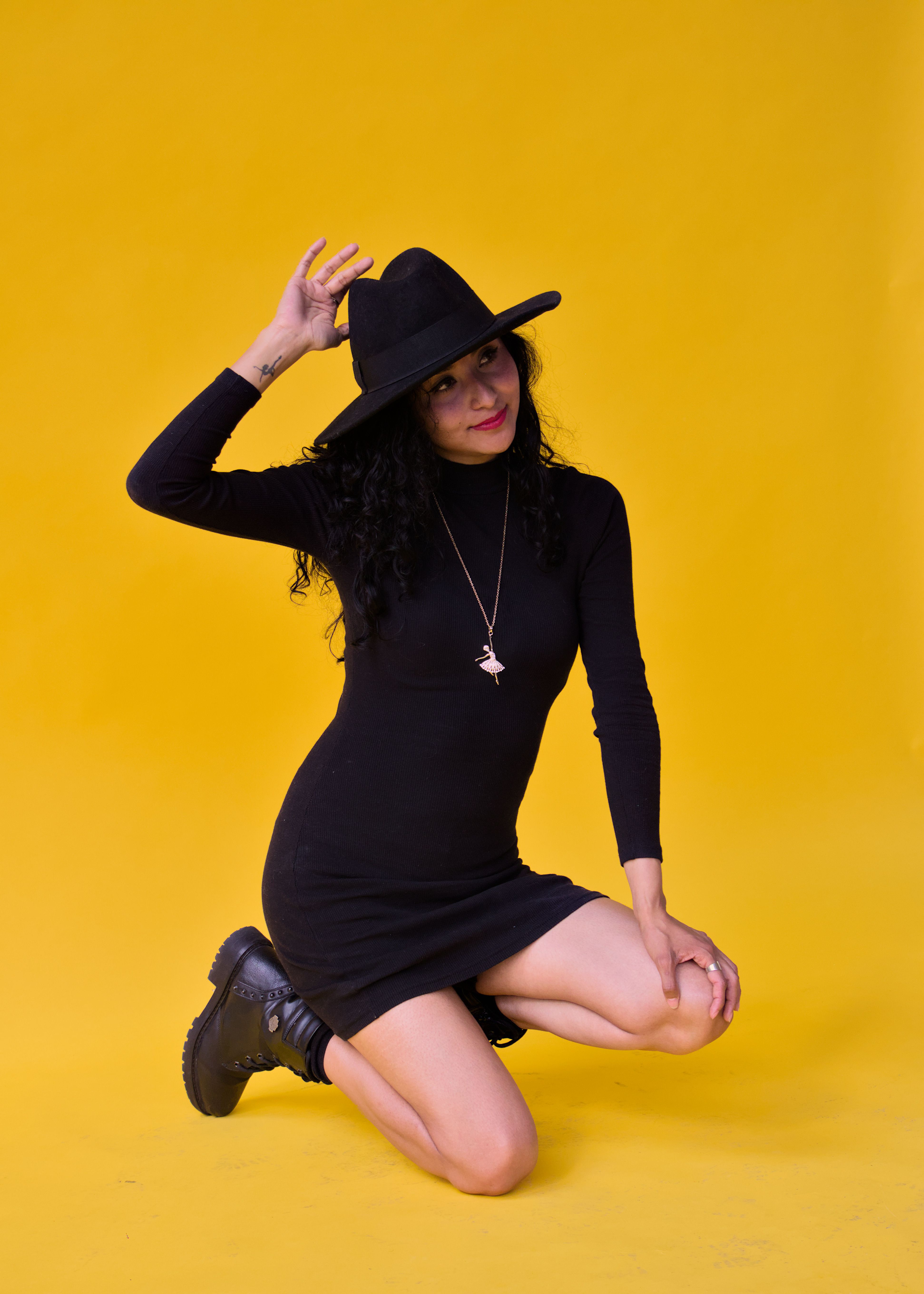 Woman in Studio Posing in Black Dress and Hat · Free Stock Photo