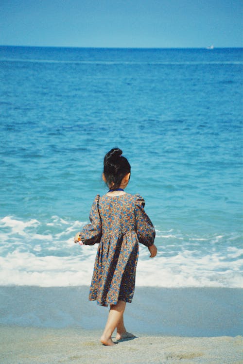 Little Girl Walking on the Beach