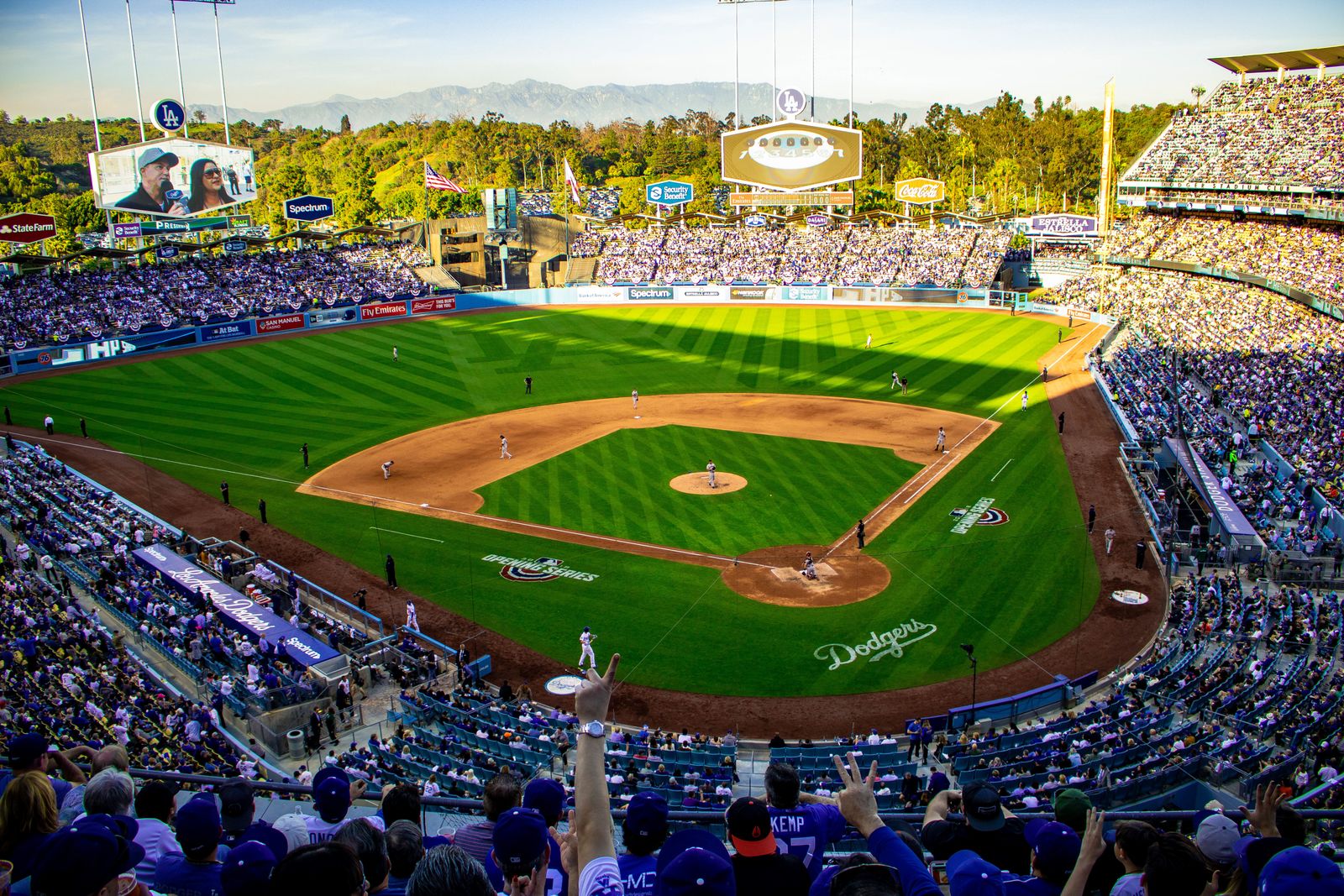 A packed Dodger Stadium crowd watching a game from the upper deck