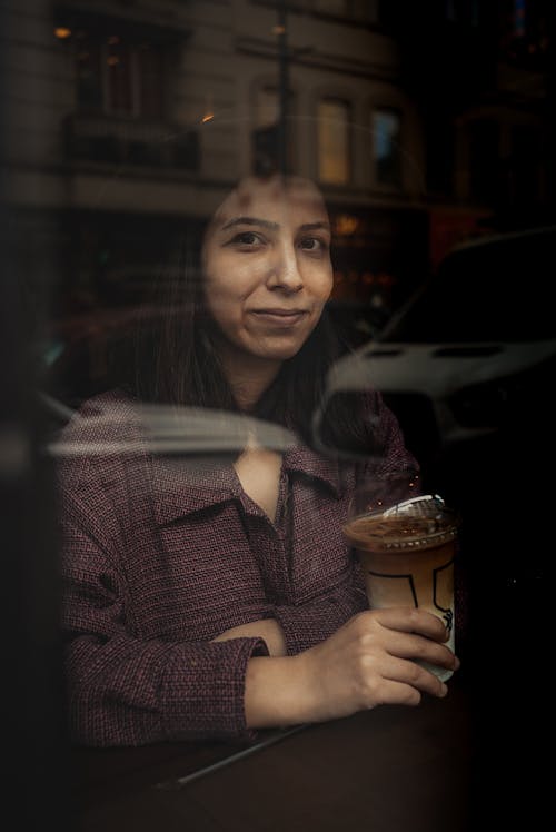 Free Woman Holding Disposable Cup with Coffee in Cafe Stock Photo