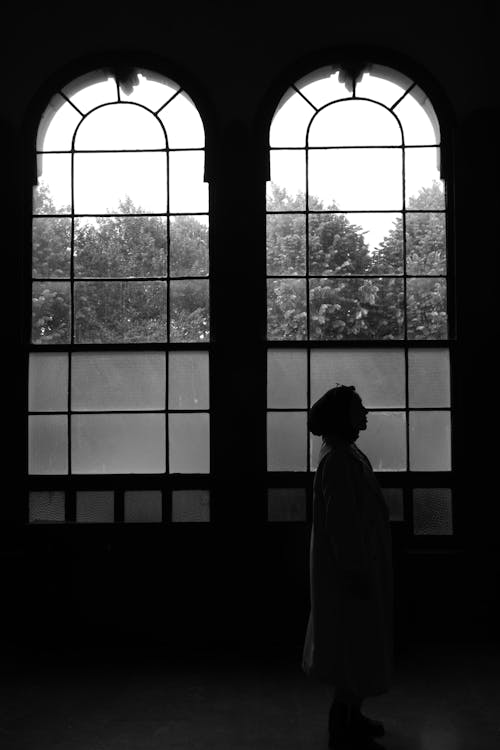 Woman in Front of Windows in Black and White 